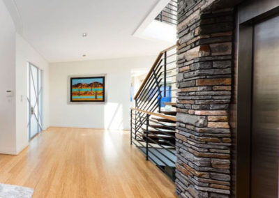 Passageway with hardwood flooring through Perth home